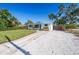 Manicured front lawn with mature trees highlights the home's exterior at 4001 W North A St, Tampa, FL 33609