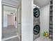 Hallway to laundry featuring a stacked washer and dryer at 4001 W North A St, Tampa, FL 33609