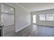 Neutral living room featuring modern flooring and great natural light from a large window at 4001 W North A St, Tampa, FL 33609