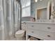 Bathroom featuring decorative shower curtain, modern vanity, and stylish design at 4017 3Rd E Ave, Bradenton, FL 34208