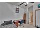 Cozy bedroom with a ceiling fan and a view into the hallway at 4017 3Rd E Ave, Bradenton, FL 34208