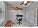 This is a bedroom with a desk and a view of a closet at 4017 3Rd E Ave, Bradenton, FL 34208