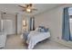 Clean bedroom showcasing a ceiling fan, walk-in closet, and ensuite bathroom at 4017 3Rd E Ave, Bradenton, FL 34208