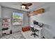 Serene bedroom with stylish decor, a window view, and ample workspace for productivity at 4017 3Rd E Ave, Bradenton, FL 34208