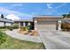 Charming single story home boasts a two-car garage, inviting walkway and mature landscaping at 4017 3Rd E Ave, Bradenton, FL 34208