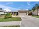 Charming single-story home with a two-car garage, well-manicured lawn, and mature landscaping at 4017 3Rd E Ave, Bradenton, FL 34208