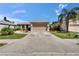 Exterior view of a single-Gathering home with a concrete driveway and mature landscaping at 4017 3Rd E Ave, Bradenton, FL 34208