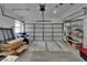 Spacious two-car garage featuring ample storage shelves and plenty of room for vehicles at 4017 3Rd E Ave, Bradenton, FL 34208