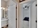 This is a view of a bathroom from a hallway entrance into a bedroom at 4017 3Rd E Ave, Bradenton, FL 34208