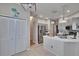 Modern kitchen with stainless steel appliances, white cabinets, pendant lighting, and ample counter space at 4017 3Rd E Ave, Bradenton, FL 34208