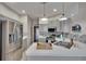 Well-lit kitchen featuring stainless steel appliances, gray cabinets, and a breakfast bar at 4017 3Rd E Ave, Bradenton, FL 34208