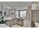Modern kitchen with stainless steel appliances and bright breakfast nook with great natural light at 4017 3Rd E Ave, Bradenton, FL 34208