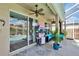 Covered lanai with ceiling fan, furniture, and views of a screened-in pool at 4017 3Rd E Ave, Bradenton, FL 34208