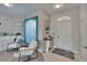 Bright living area with neutral tones, stylish furnishings, and an arched window above the front door at 4017 3Rd E Ave, Bradenton, FL 34208