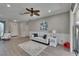 Cozy living area with a ceiling fan, neutral colors, and ample natural light at 4017 3Rd E Ave, Bradenton, FL 34208
