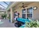 Patio with a blue sectional, adjacent to a pool area, perfect for outdoor living at 4017 3Rd E Ave, Bradenton, FL 34208