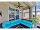 Relaxing screened patio with comfortable seating, ceiling fan, and pleasant outdoor view at 4017 3Rd E Ave, Bradenton, FL 34208