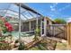 Enclosed pool area with spa, stone border and tropical landscaping at 4017 3Rd E Ave, Bradenton, FL 34208