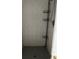 View of standing shower with shelving and chrome fixtures at 4031 Chesswood Dr, Holiday, FL 34691