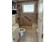 Bathroom with window, hand rails, seat in shower and hand-held shower at 4031 Chesswood Dr, Holiday, FL 34691
