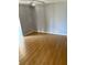 Bedroom featuring light colored walls and light hardwood floors and ceiling fan at 4031 Chesswood Dr, Holiday, FL 34691