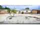 Well-maintained single-story home with a tidy rock garden and a circular driveway, offering convenient access at 4031 Chesswood Dr, Holiday, FL 34691