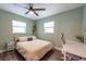 Bedroom with work space, closet, and a large window at 4311 W Oklahoma Ave, Tampa, FL 33616