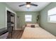 Bedroom with work space, closet, and a large window at 4311 W Oklahoma Ave, Tampa, FL 33616