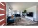 Bright and open living room featuring a cozy seating area and modern decor, creating an inviting atmosphere at 4311 W Oklahoma Ave, Tampa, FL 33616