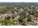 Aerial view of a neighborhood with mature trees and city in the distance at 4410 19Th N St, St Petersburg, FL 33714