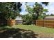 Fenced backyard featuring a well-maintained lawn and mature trees, offering privacy at 4410 19Th N St, St Petersburg, FL 33714