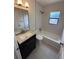 Updated bathroom with shower/tub combo and modern vanity at 4410 19Th N St, St Petersburg, FL 33714