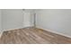 The bedroom features wood-look flooring and a white door at 4410 19Th N St, St Petersburg, FL 33714