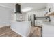 Bright kitchen features stainless steel appliances, black hardware and a modern island at 4410 19Th N St, St Petersburg, FL 33714