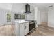 Kitchen island features a stainless steel range and overlooks the yard through a glass door at 4410 19Th N St, St Petersburg, FL 33714