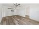 Open living room features wood-look flooring and a TV mount on the wall at 4410 19Th N St, St Petersburg, FL 33714