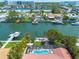 Waterfront home featuring a private pool, boat dock, and stunning canal views, perfect for boating enthusiasts and relaxing outdoors at 4490 38Th S Way, St Petersburg, FL 33711