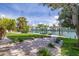 Beautiful waterfront backyard with lush landscaping, dock, and canal access at 4490 38Th S Way, St Petersburg, FL 33711