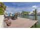 Private boat dock with outdoor furniture overlooking the tranquil canal waters at 4490 38Th S Way, St Petersburg, FL 33711
