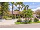 Attractive single-story home with well-manicured landscaping and a circular driveway at 4490 38Th S Way, St Petersburg, FL 33711