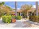 Charming front entrance with a mosaic tile walkway, mature trees, and space for seating at 4490 38Th S Way, St Petersburg, FL 33711