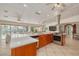Open kitchen featuring stainless steel appliances, a white countertop, and access to an outdoor pool area at 4490 38Th S Way, St Petersburg, FL 33711