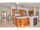 Bright kitchen features stainless steel appliances, an island with a cooktop, and custom cabinetry at 4490 38Th S Way, St Petersburg, FL 33711