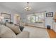 Bright living room with large window and cozy furniture arrangement at 4490 38Th S Way, St Petersburg, FL 33711