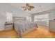 Serene main bedroom with hardwood floors, neutral colors, and bright windows at 4490 38Th S Way, St Petersburg, FL 33711