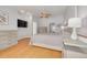 This main bedroom features wood floors, neutral paint and ceiling fan with lighting at 4490 38Th S Way, St Petersburg, FL 33711