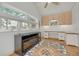 Bright sunroom with mosaic tile flooring and built-in desk and cabinetry at 4490 38Th S Way, St Petersburg, FL 33711