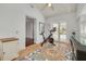 Bright sunroom with mosaic tile and exercise bike with views of the backyard at 4490 38Th S Way, St Petersburg, FL 33711