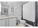 Bathroom featuring a single vanity, toilet, and shower with curtain at 4809 Walnut Ridge Rd, Land O Lakes, FL 34638