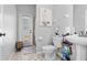 Bathroom featuring a walk-in shower, toilet, and a pedestal sink at 4809 Walnut Ridge Rd, Land O Lakes, FL 34638